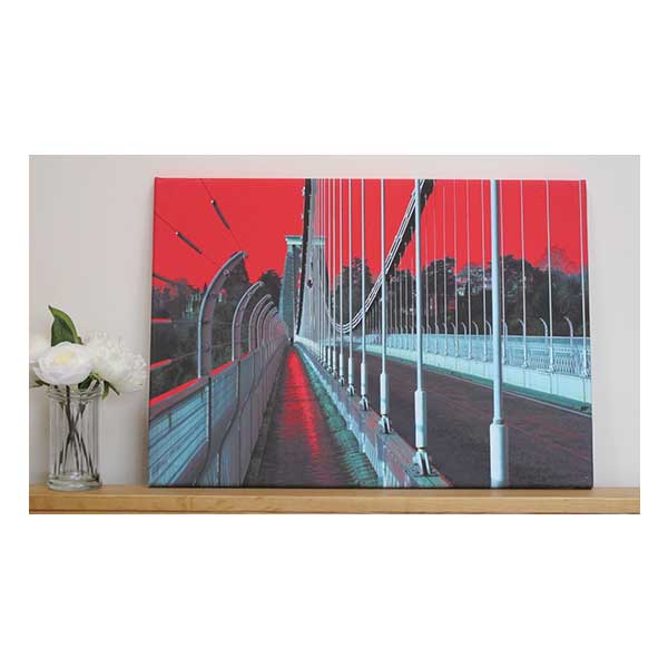 Canvas-Suspension-Bridge-with-Red-Backdrop
