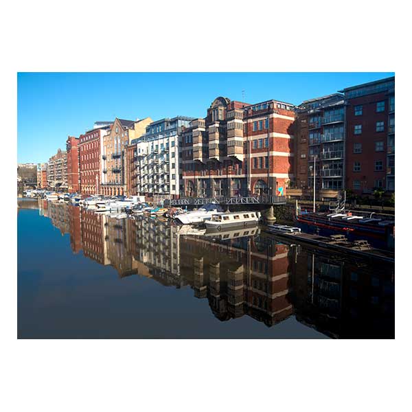 Buildings reflected in water