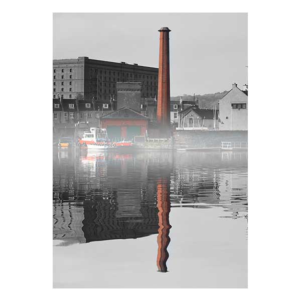 Boatyard in fog with buildings in background